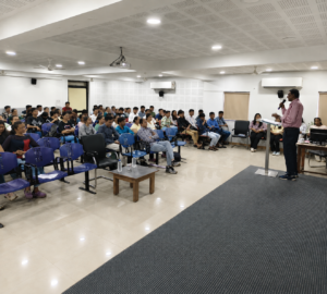 Speaker conducting a drug awareness seminar for students at a CHARUSAT University auditorium